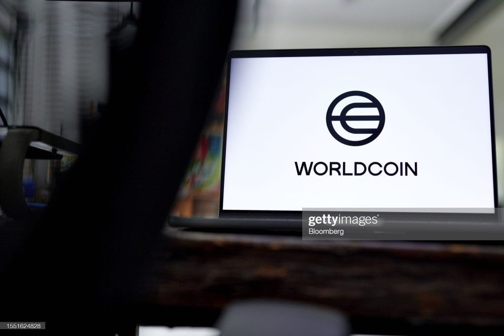 The Worldcoin logo on a laptop arranged in Germantown, New York, US, on Monday, July 24, 2023. Worldcoin, the digital identity and crypto payments project co-founded by OpenAI Chief Executive Officer Sam Altman, launched on Monday. Photographer: Gabby Jones/Bloomberg via Getty Images