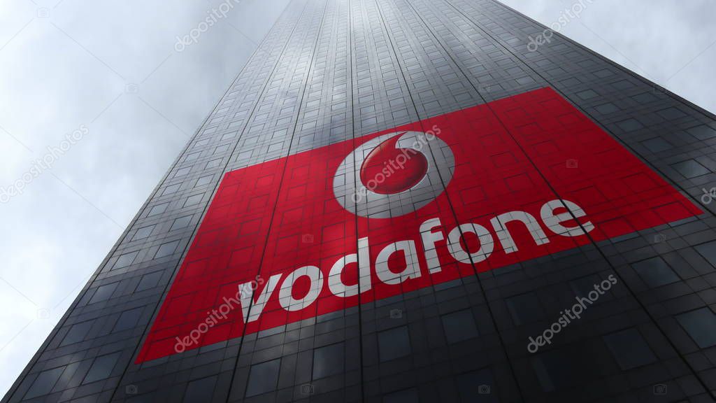 Vodafone logo on a skyscraper facade reflecting clouds. Editorial 3D rendering